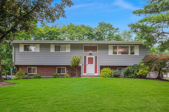 21 Brockton Rd, Spring Valley, NY 10977 - raised ranch featuring a front yard and brick siding
