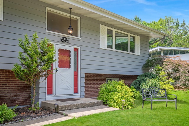 21 Brockton Rd, Spring Valley, NY 10977 - entrance to property featuring brick siding and a yard