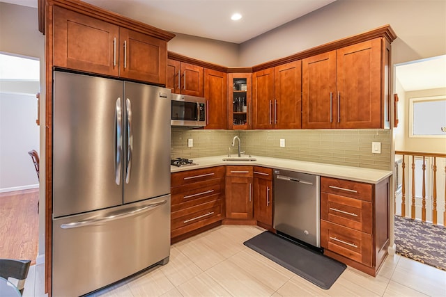 21 Brockton Rd, Spring Valley, NY 10977 - kitchen with appliances with stainless steel finishes, light countertops, tasteful backsplash, glass insert cabinets, and recessed lighting