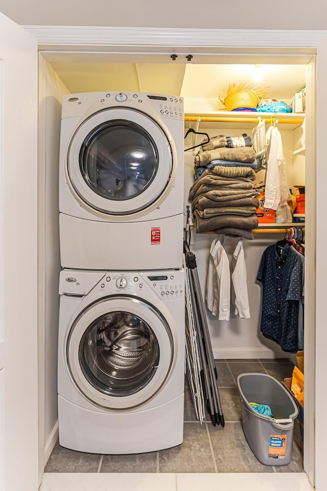 21 Brockton Rd, Spring Valley, NY 10977 - washroom with stacked washer / drying machine and baseboards