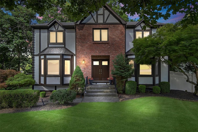 70 Walter Dr, Stony Point, NY 10980 - tudor-style house featuring stucco siding and brick siding