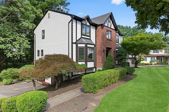 70 Walter Dr, Stony Point, NY 10980 - view of front facade featuring a front yard and roof with shingles