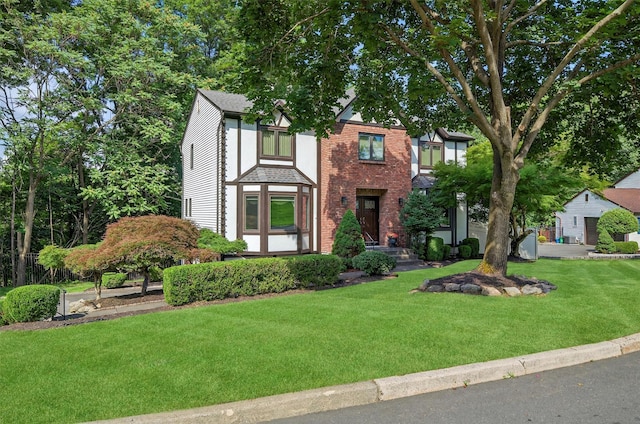 70 Walter Dr, Stony Point, NY 10980 - tudor home with a front yard and brick siding