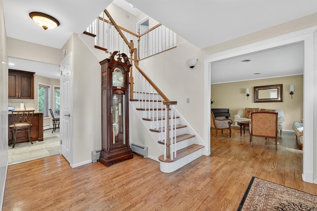 70 Walter Dr, Stony Point, NY 10980 - foyer featuring stairway, light wood-style flooring, and baseboard heating