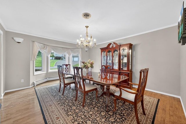 70 Walter Dr, Stony Point, NY 10980 - dining area with a baseboard radiator, a chandelier, ornamental molding, and light wood finished floors