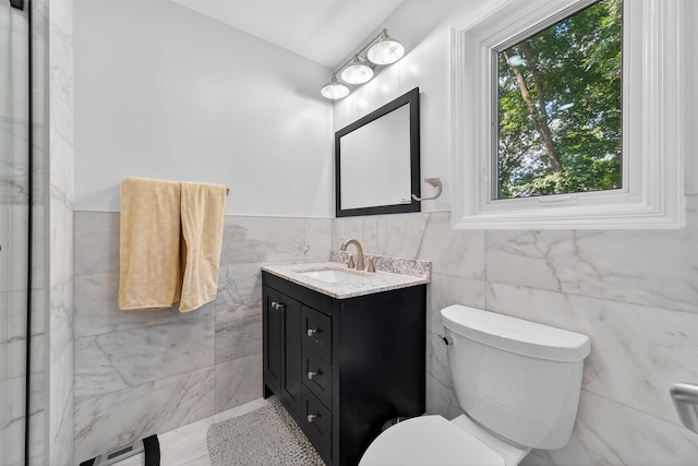 70 Walter Dr, Stony Point, NY 10980 - bathroom featuring vanity, tile walls, and wainscoting