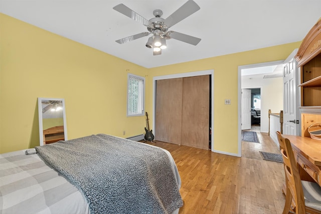 70 Walter Dr, Stony Point, NY 10980 - bedroom with multiple windows, light wood-style flooring, a closet, and a ceiling fan