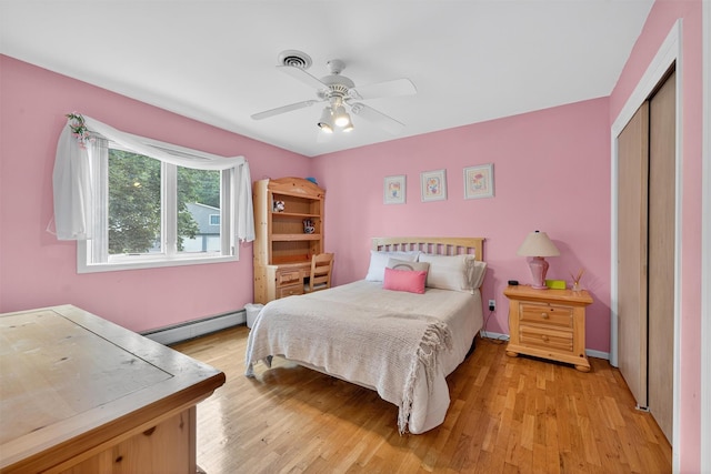 70 Walter Dr, Stony Point, NY 10980 - bedroom with baseboard heating, a closet, light wood-style flooring, and ceiling fan