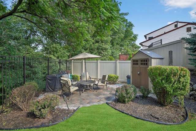 70 Walter Dr, Stony Point, NY 10980 - fenced backyard with a storage unit and a patio