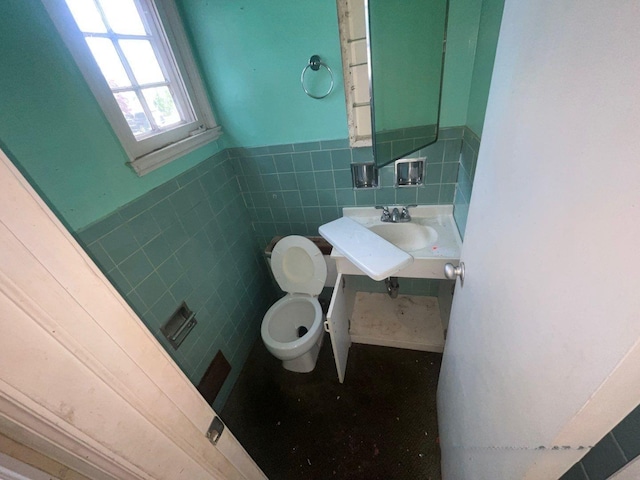 625 Edwards St Unit A, Westhampton Beach, NY 11978 - bathroom with tile walls, wainscoting, and vanity