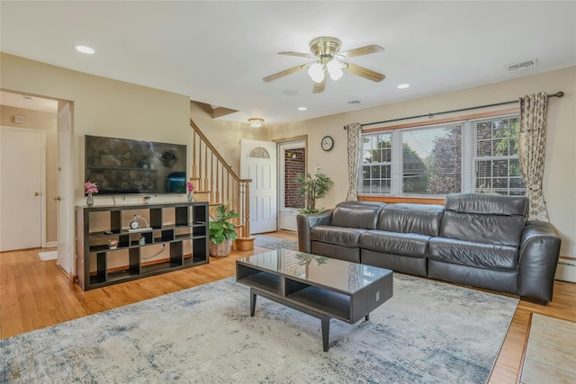 502 S 11th St, New Hyde Park, NY 11040 - living area with a ceiling fan, stairway, wood finished floors, and recessed lighting