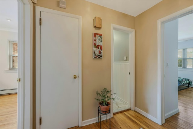 502 S 11th St, New Hyde Park, NY 11040 - hallway featuring light wood-style floors and baseboard heating