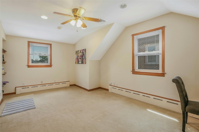 502 S 11th St, New Hyde Park, NY 11040 - additional living space with a baseboard heating unit, lofted ceiling, light colored carpet, a ceiling fan, and recessed lighting
