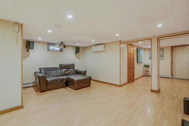 502 S 11th St, New Hyde Park, NY 11040 - living room with a baseboard heating unit, a wall unit AC, light wood-type flooring, recessed lighting, and a drop ceiling