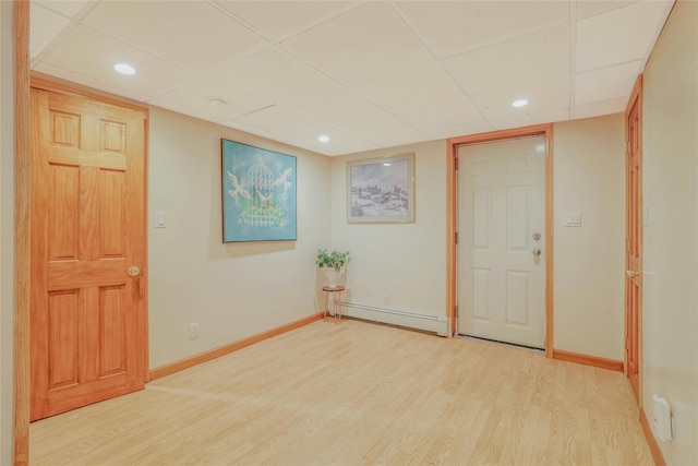 502 S 11th St, New Hyde Park, NY 11040 - foyer featuring a baseboard heating unit, a paneled ceiling, light wood-type flooring, and recessed lighting
