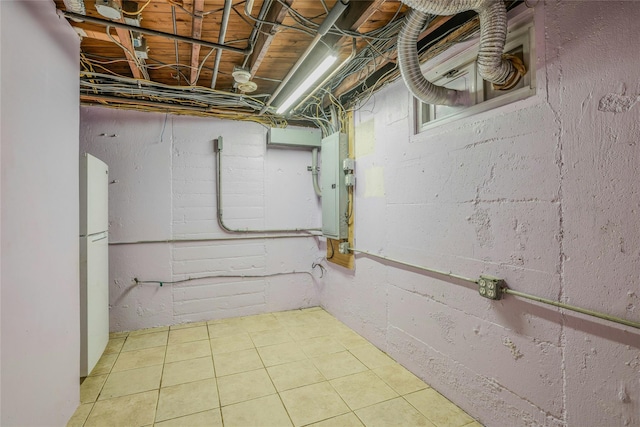 502 S 11th St, New Hyde Park, NY 11040 - basement with freestanding refrigerator