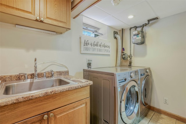 502 S 11th St, New Hyde Park, NY 11040 - laundry area featuring cabinet space, washing machine and dryer, and light tile patterned floors