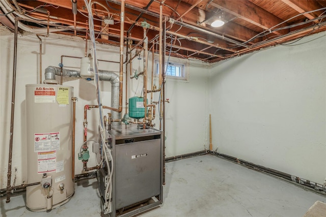 502 S 11th St, New Hyde Park, NY 11040 - utility room with water heater and a heating unit