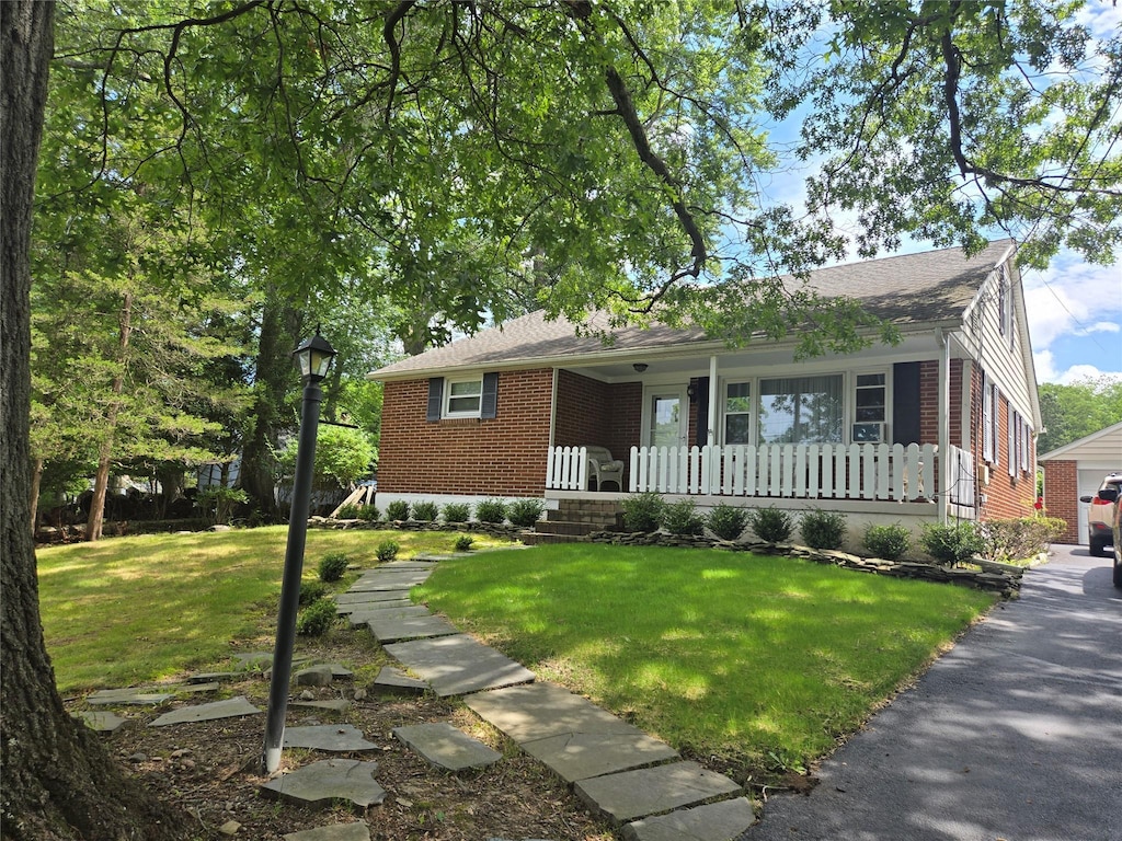 3 Birch St, Airmont, NY 10952 - single story home with brick siding, a porch, a front lawn, and roof with shingles