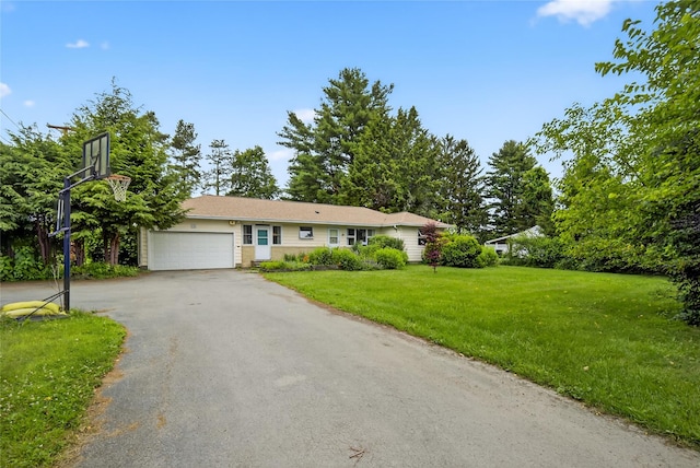 7641 N Broadway, Red Hook, NY 12571 - single story home featuring asphalt driveway, an attached garage, and a front yard
