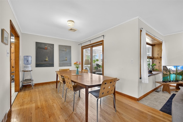 7641 N Broadway, Red Hook, NY 12571 - dining room featuring light wood-style floors and ornamental molding