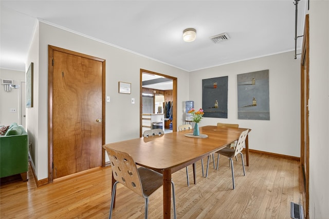 7641 N Broadway, Red Hook, NY 12571 - dining space with light wood-style flooring and ornamental molding