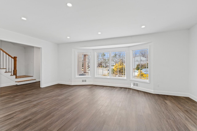 12 Foxhurst Ct, Manhasset Hills, NY 11040 - unfurnished living room featuring dark wood finished floors, stairway, and recessed lighting