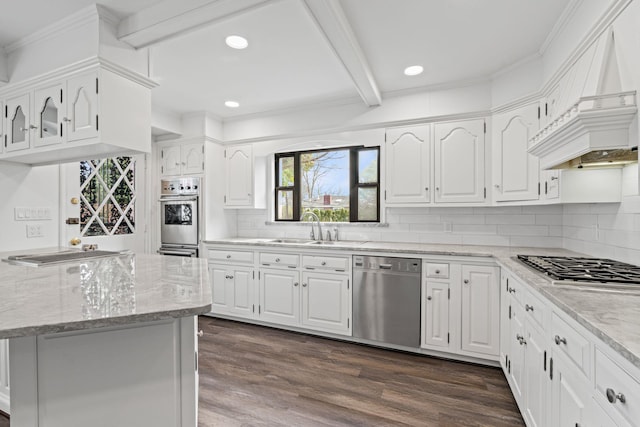12 Foxhurst Ct, Manhasset Hills, NY 11040 - kitchen with appliances with stainless steel finishes, beam ceiling, light stone counters, white cabinets, and recessed lighting