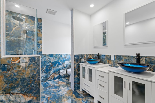 12 Foxhurst Ct, Manhasset Hills, NY 11040 - full bathroom featuring a marble finish shower, double vanity, marble finish floors, and recessed lighting