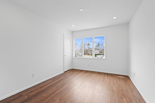 12 Foxhurst Ct, Manhasset Hills, NY 11040 - spare room with wood finished floors and recessed lighting