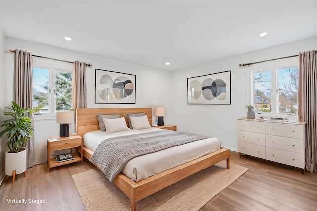 12 Foxhurst Ct, Manhasset Hills, NY 11040 - bedroom featuring multiple windows, light wood-type flooring, and recessed lighting