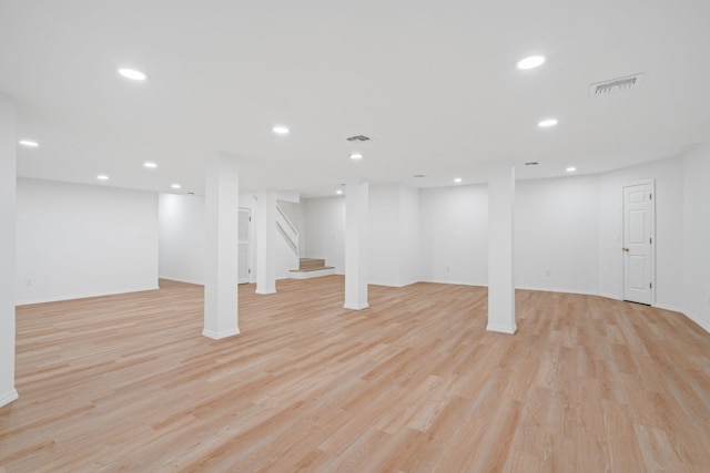 12 Foxhurst Ct, Manhasset Hills, NY 11040 - finished basement with light wood-type flooring, recessed lighting, and stairway