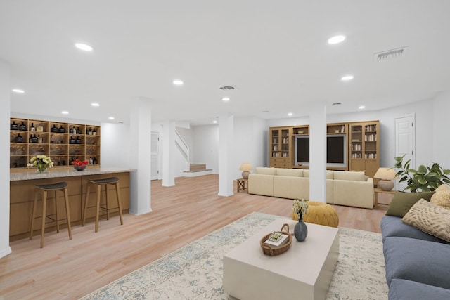 12 Foxhurst Ct, Manhasset Hills, NY 11040 - living room with light wood-style flooring, stairway, and recessed lighting