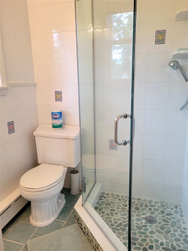 67 Wakeman Rd, Hampton Bays, NY 11946 - bathroom with a stall shower, tile patterned flooring, and tile walls
