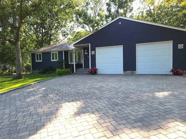 67 Wakeman Rd, Hampton Bays, NY 11946 - ranch-style house featuring decorative driveway and an attached garage