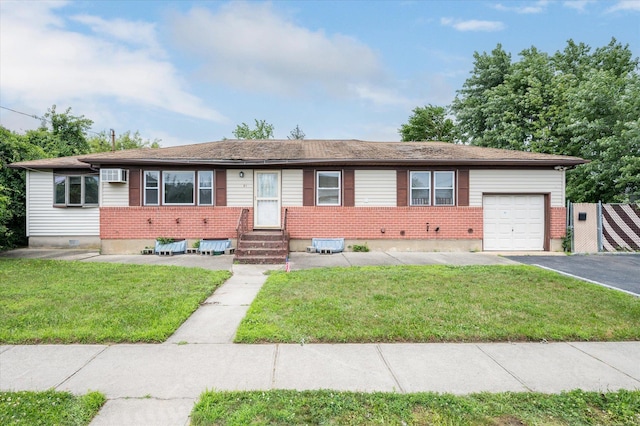 21 Silver St, West Babylon, NY 11704 - ranch-style house featuring an attached garage, an AC wall unit, a front yard, asphalt driveway, and brick siding