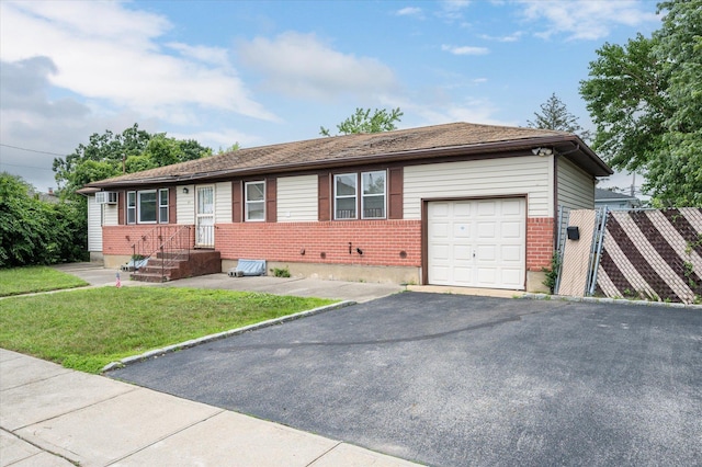 21 Silver St, West Babylon, NY 11704 - ranch-style house with brick siding, a garage, and asphalt driveway