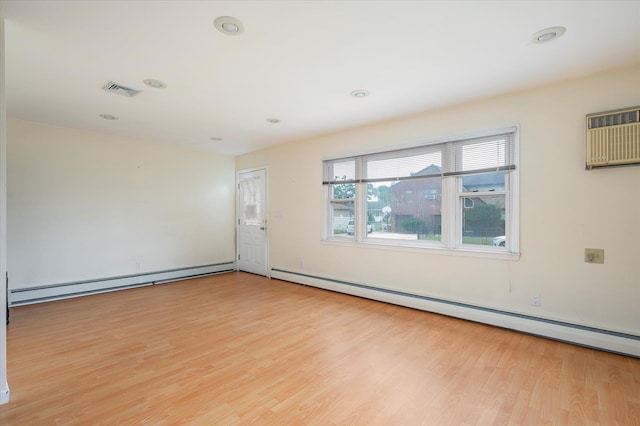 21 Silver St, West Babylon, NY 11704 - unfurnished room with baseboard heating, wood finished floors, and recessed lighting