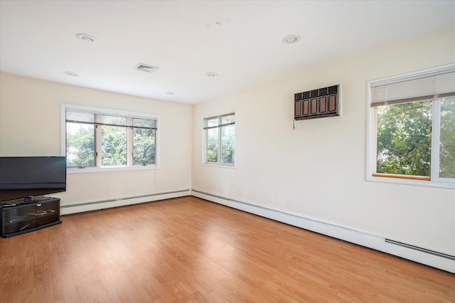 21 Silver St, West Babylon, NY 11704 - unfurnished living room with wood finished floors, baseboard heating, and recessed lighting
