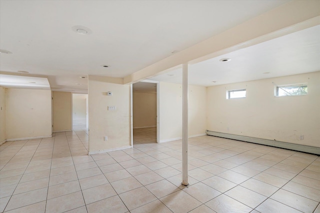 21 Silver St, West Babylon, NY 11704 - unfurnished room featuring a baseboard radiator and light tile patterned floors