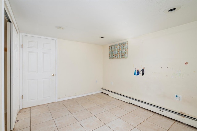 21 Silver St, West Babylon, NY 11704 - spare room with a baseboard radiator, light tile patterned floors, and recessed lighting