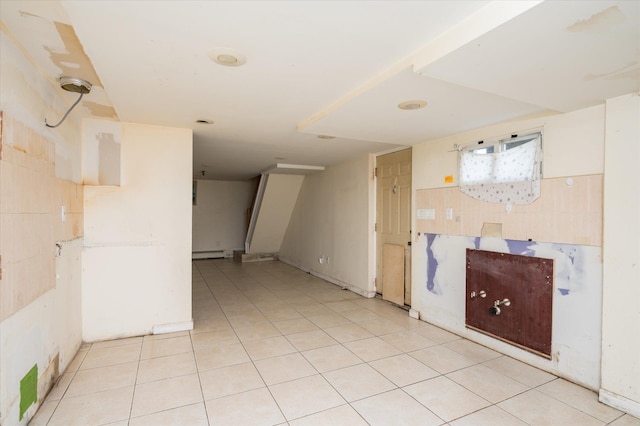 21 Silver St, West Babylon, NY 11704 - empty room with a baseboard radiator and light tile patterned floors