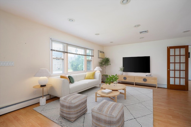 21 Silver St, West Babylon, NY 11704 - living room featuring wood finished floors, an AC wall unit, baseboard heating, and recessed lighting
