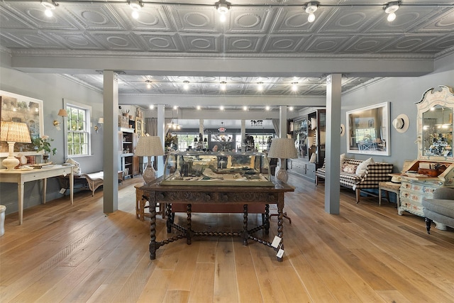 259 Westchester Ave, Pound Ridge, NY 10576 - living room with an ornate ceiling, light wood-type flooring, ornamental molding, and decorative columns