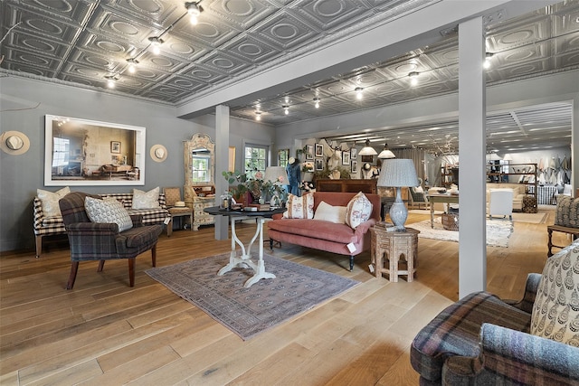 259 Westchester Ave, Pound Ridge, NY 10576 - living room with decorative columns, an ornate ceiling, and light wood-style floors