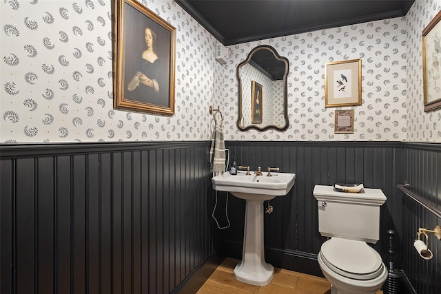 259 Westchester Ave, Pound Ridge, NY 10576 - half bath with wallpapered walls, wainscoting, crown molding, and wood finished floors
