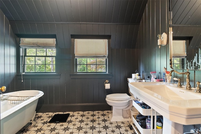 259 Westchester Ave, Pound Ridge, NY 10576 - full bath with a soaking tub, tile patterned floors, wooden walls, and wood ceiling
