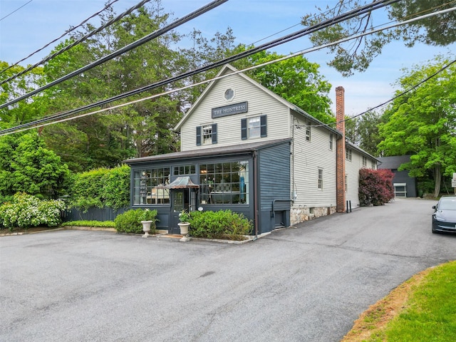 259 Westchester Ave, Pound Ridge, NY 10576 - view of front of house with a chimney