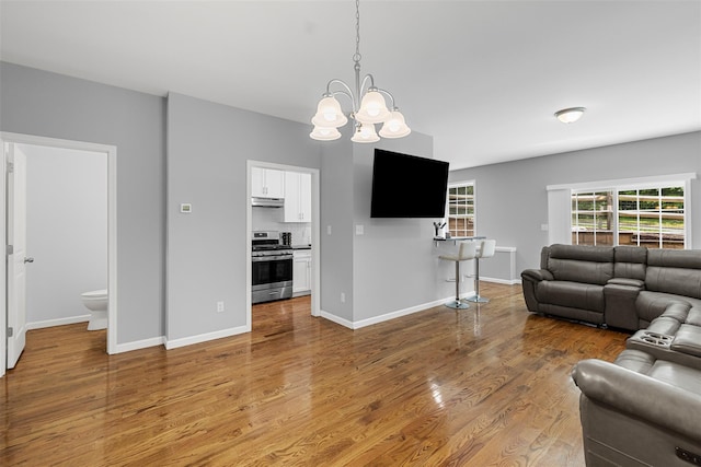 28 Pinto Rd W, Middletown, NY 10941 - living area with wood finished floors and a chandelier