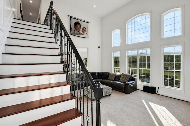 28 Viola Ct, Wappingers Falls, NY 12590 - stairs featuring healthy amount of natural light, carpet, a towering ceiling, and recessed lighting